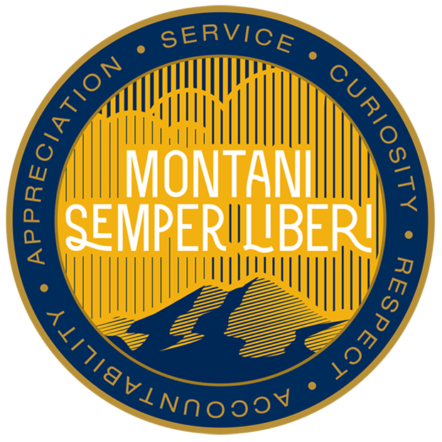 Gold etched background with the words Montani Semper Liberi above a mountaintop
